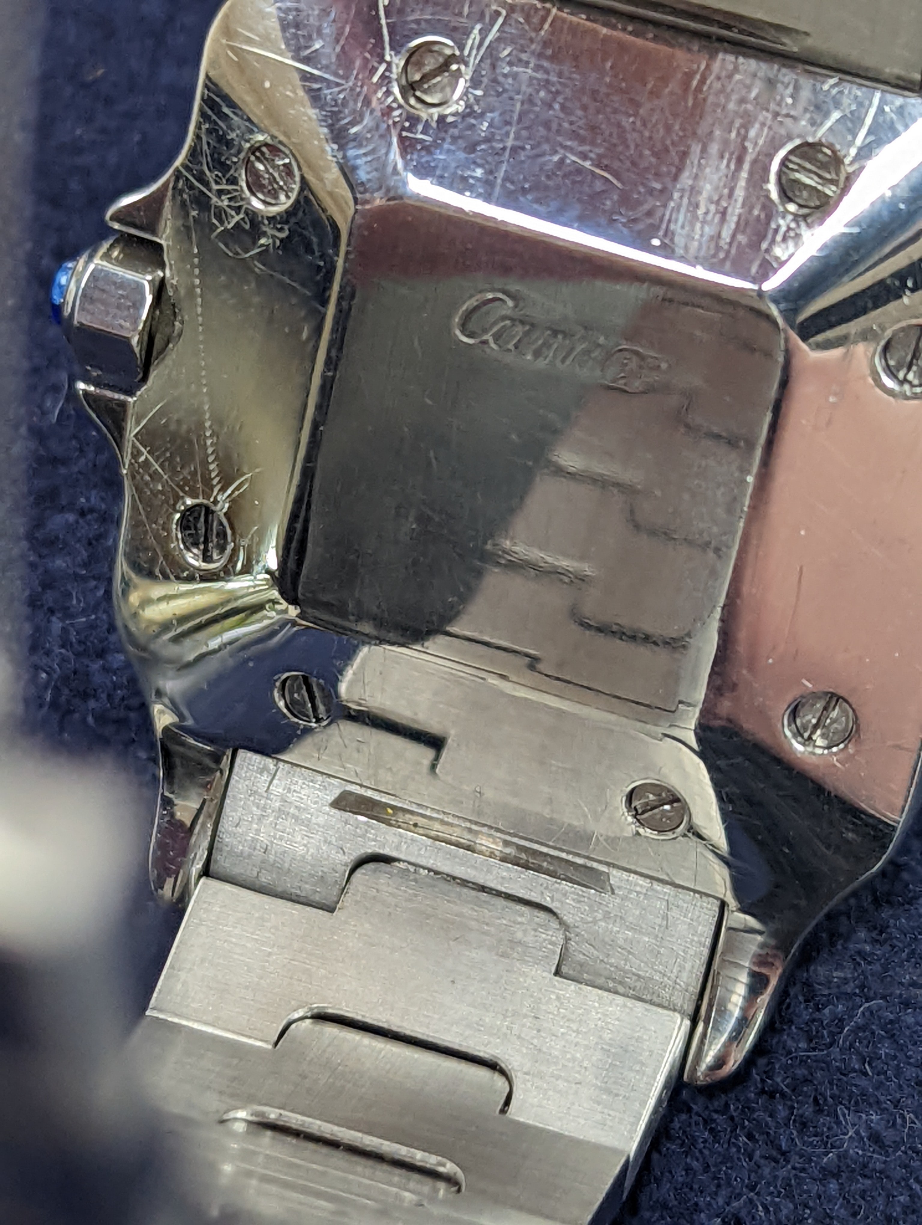 A gentleman's stainless steel Cartier Santos automatic wristwatch, on a stainless steel Cartier bracelet, no box or papers, cased diameter 30mm.